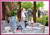 Round tables laid up with rustic flowers and vintage china